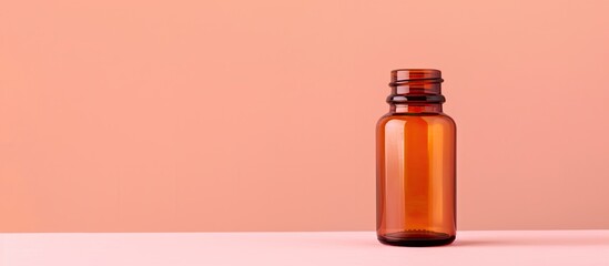 Wall Mural - Bottle for pills placed on a beautiful peach background with copy space image.