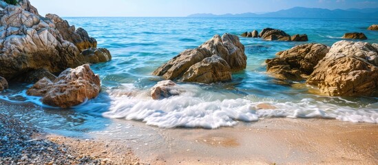 Wall Mural - Natural background with sea and rocks, providing copy space image.