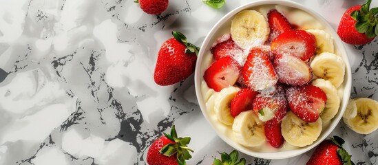 Poster - Strawberry dessert with fresh banana on a marble background features a copy space image.