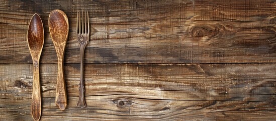 Aufkleber - Table with a wooden spoon and fork, creating a rustic setting, and a blank area available for inserting a picture.