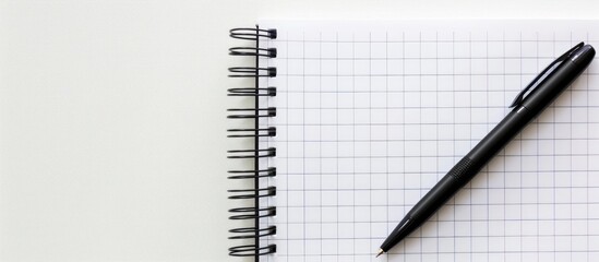 Poster - Business concept with a close-up of an empty notebook beside a black pen against a copy space image.