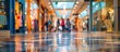 © HN Works - Blurry shopping mall hallway with customers in the background, ideal for copy space image.