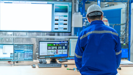 Engineer working at control room,Manager control system,Technician man monitoring program from a lot of monitor