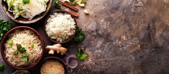 Poster - Asian meal ingredients like noodles, rice, cabbage, ginger, and onion for a nutritious meal preparation, viewed from above with room for text in the image.