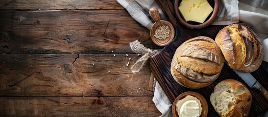 Poster - Wooden table set up with bread, butter, and a wide open space for adding text in the image.