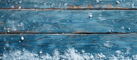 Poster - Christmas-themed background featuring blue wooden texture with snow, ideal for adding text or images in the copy space image.