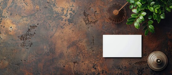 Sticker - Top view of a modern business card mockup on a granite surface next to a fan on a brown grunge background, creating a stylish template for branding with copy space image.