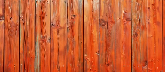 Wall Mural - Wooden fence background with knots, painted orange, offers copy space image.