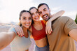 © Xavier Lorenzo - Three young sportive friends taking selfie after workout routine outdoor. Friendship, sport and healthy lifestyle concept