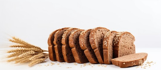 Poster - Top view of freshly baked rye bread slices on a white background with copy space image.