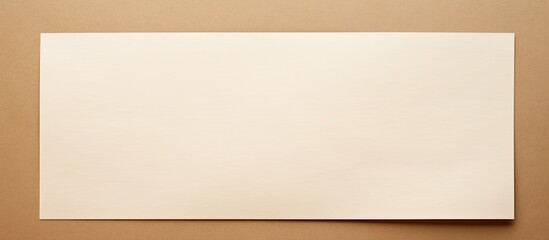 Aufkleber - Overhead view of a blank white paper on a beige background with copy space image.