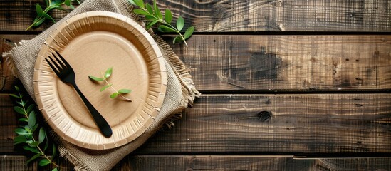Aufkleber - Eco-friendly paper plate and fork set displayed on a rustic wooden table with ample space for adding text or images.