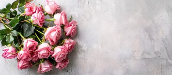 Wall Mural - Pink roses bouquet seen from above on a blank backdrop with copy space image.