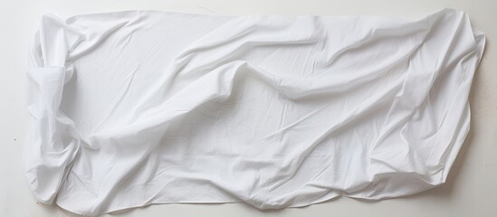 Poster - White background with crumpled fabric napkin, providing a copy space image.