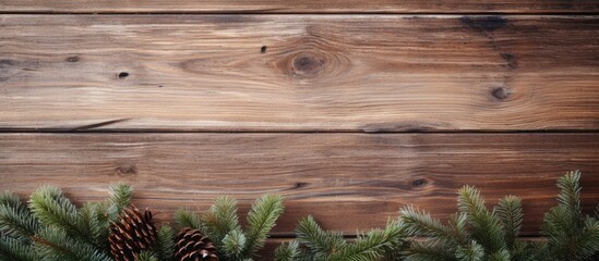 Poster - Wooden board background showcasing a Christmas fir tree with ample space for additional content or text, known as a copy space image.