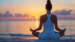 © authapol - Attractive woman meditating on a beach at sunrise, with a calm ocean and clear sky in the background, emphasizing relaxation and mental well-being