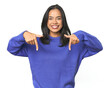 © Asier - Simple portrait of a young Latina points down with fingers, positive feeling.