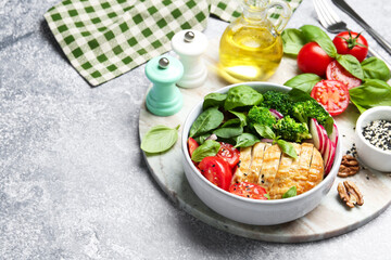 Wall Mural - Healthy meal. Delicious chicken, vegetables and spinach served on light grey table, space for text