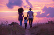 © FATNA - pink vibrant sunset field - black African american couple and child walking away - full view from behind - silhouette of a loving diversity black ethnic descendant family