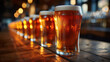 © Q77photo - A row of beer glasses on a bar counter