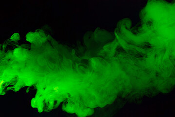 Wall Mural - Green steam on a black background.