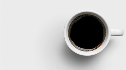 Overhead View of a White Mug Filled With Black Coffee on a White Surface