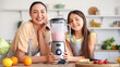 © Pixel-Shot - Little girl and her mother making smoothie with blender in kitchen