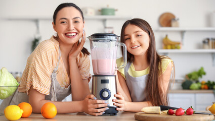 Poster - Little girl and her mother making smoothie with blender in kitchen