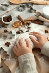 Canvas Print - Female hands with raw dough, ingredients and utensils for preparing sweet Christmas cookies on wooden table