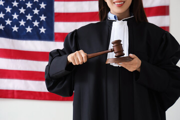 Sticker - Female judge with gavel against USA flag, closeup. Labour Day celebration