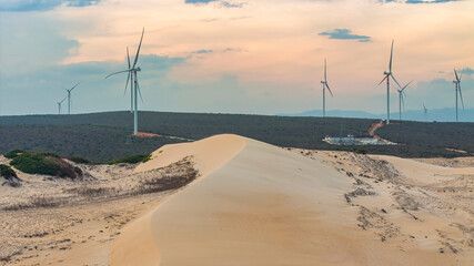 Wall Mural - windmill park with clouds and a blue sky, wind mill turbines in the ocean aerial view of a wind farm