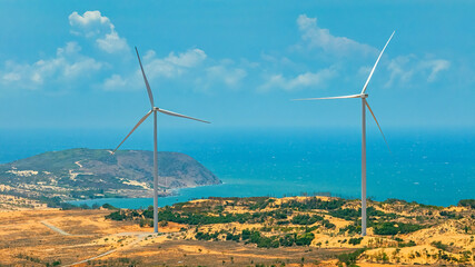 Wall Mural - panoramic view of wind farm or wind park, with high wind turbines for generation electricity with co