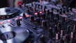 © redflower - Close-up View of Modern DJ Setup with Controller and Mixer