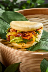 Wall Mural - Fresh Vegetarian Bao Bun with Colorful Vegetables in Bamboo Steamer