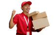 © Jamaludinyusup - Asian delivery man or courier giving a thumbs-up gesture at the camera while carrying a cardboard box package parcel, isolated on a white background