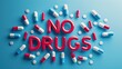 © Sahir_Stock - No drugs message with colorful pills scattered around on a blue background, promoting drug-free lifestyle and health awareness