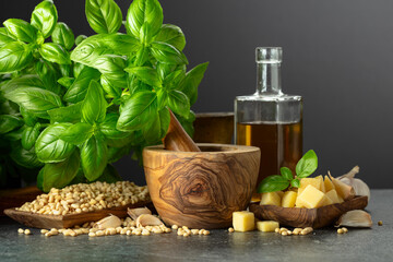 Sticker - Ingredients for making Pesto sauce on a black stone table.