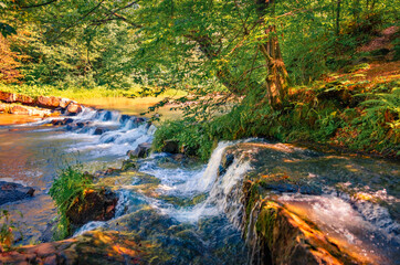 Wall Mural - Magnificent summer scene of Pid Skelyamy waterfall. Superb morning view of Sukel' River. Perfect landscape of Carpathian mounatains, Ukraine, Europe. Beauty of nature concept background.