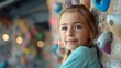 © naphat - A young girl practices rock climbing at an indoor gym, challenging herself and conquering new heights. Focused expression and safety equipment showcase the power of movement.