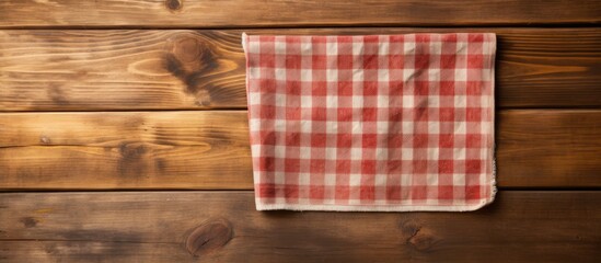 Aufkleber - Wooden cutting board and kitchen towel on a wooden surface providing ample copy space image.