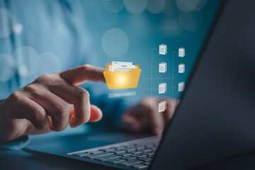 Document management concept. Finger touch on folder icons on virtual screen. Document Management System, DMS Online document database, software for searching and management of company files and data.