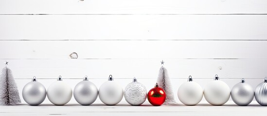 Poster - Christmas decorations arranged on a white wooden surface for a festive look, with ample space for text or other elements in the image.