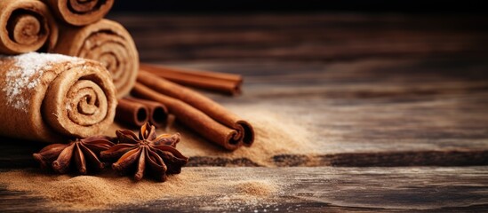 Poster - Ceylon cinnamon sticks displayed on a textured wooden background with a cinnamon roll, powder, perfect for baking, desserts, or drinks. Close-up with room for text, copy space image.