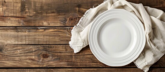 Wall Mural - Wooden table with a white plate, showcasing a copy space image.