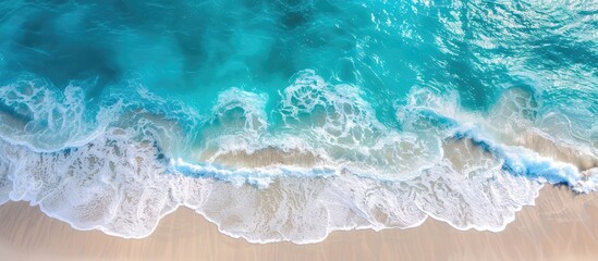 Poster - Capturing a stunning aerial image of a pristine tropical beach with foamy waves and crystal-clear waters, a perfect backdrop for summer vacation, featuring ample copy space.