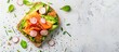 © Ilgun - Healthy fast food concept with a takeaway avocado and salmon sandwich on gluten-free grain bread, garnished with green onions, radishes, and tomatoes on a light background with copy space image.