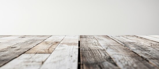 Isolated white background showcasing an empty wooden table for product display with ample copy space image.