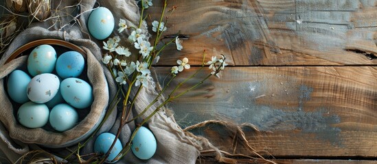 Sticker - Blue Easter eggs trend featured on a rustic festive table with a top view, enhancing the copy space image with a background of food.