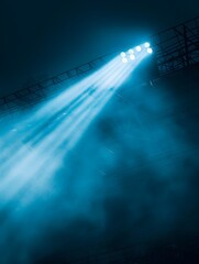 Close up of dramatic spotlight beams in an empty stadium at night