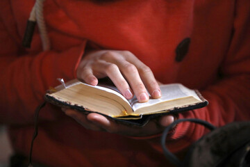 Wall Mural - European Youth meeting of Taize in Basel. Woman readig the holy bible.  Basel. Switzerland.  Switzerland.